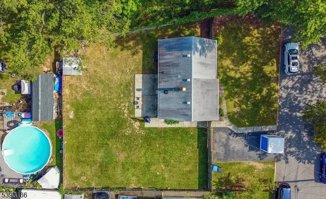front view of a brick house with a chairs
