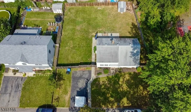 aerial view of a house with a yard