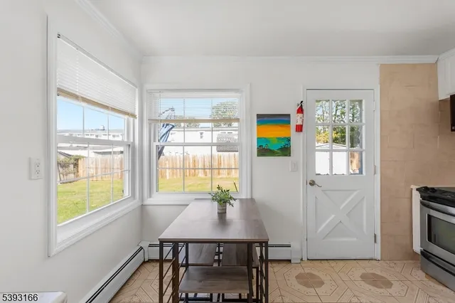a kitchen with stainless steel appliances granite countertop a sink stove and microwave