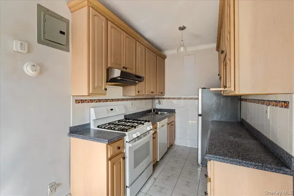 a kitchen with stainless steel appliances a sink and a stove