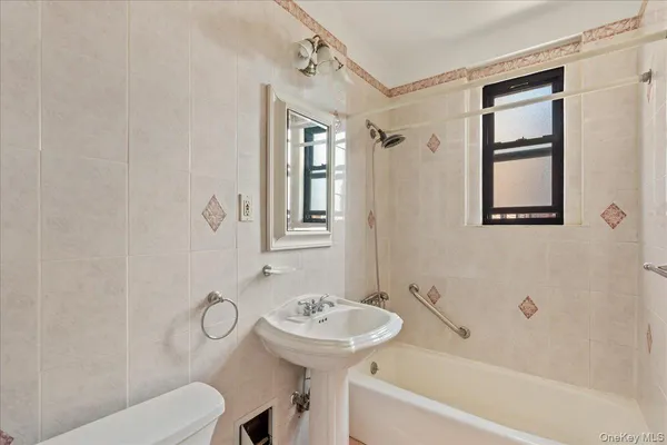 a bathroom with a sink a toilet and a bathtub
