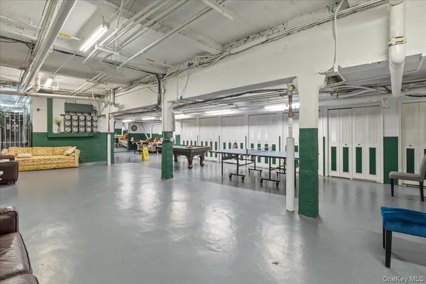 a view of a studio with wooden floor