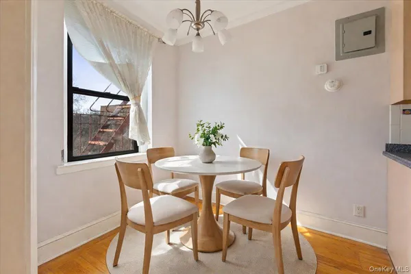 a view of a dining room with furniture and wooden floor