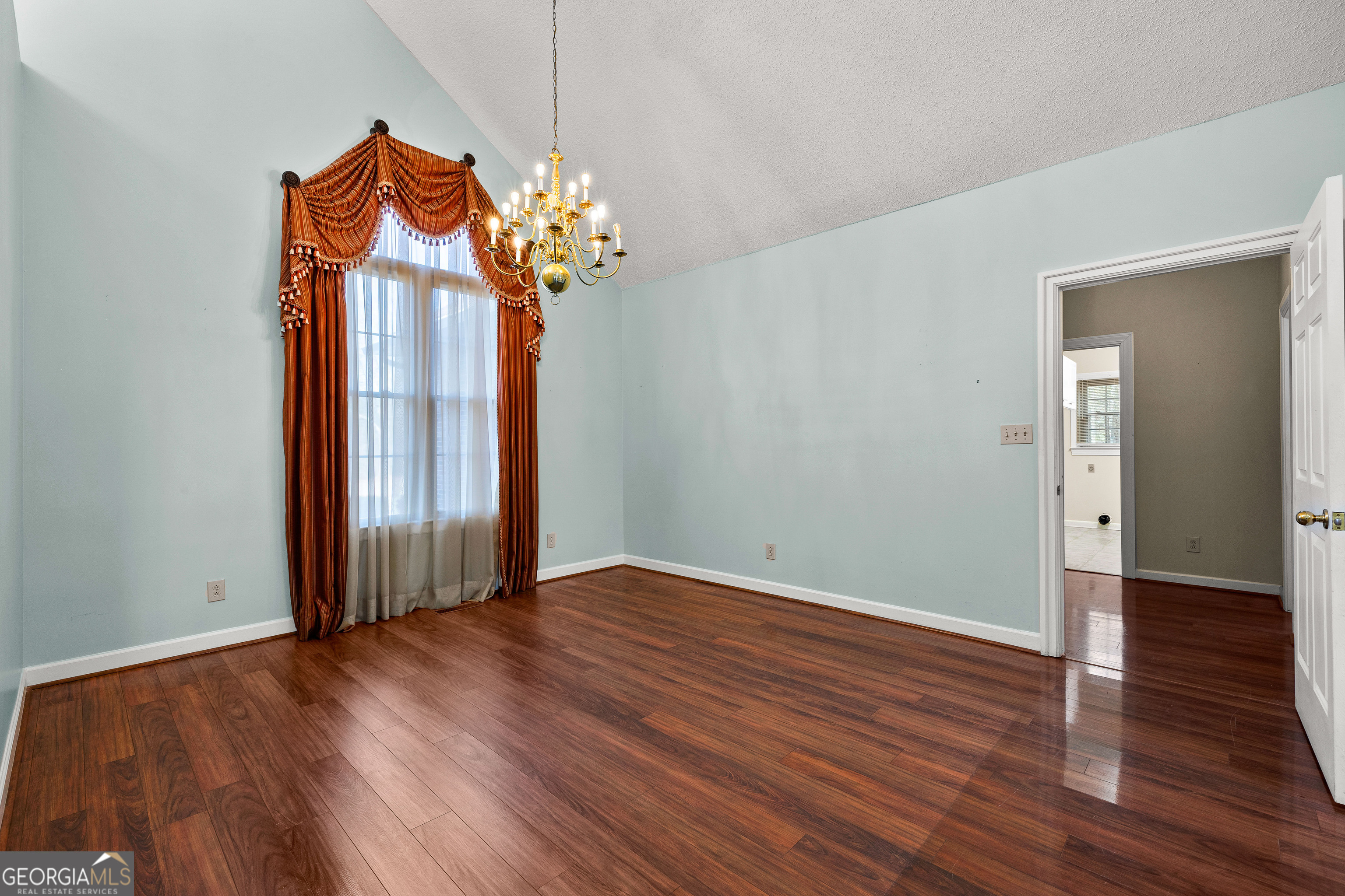 100 Beaver Run Trace Thomaston, GA 30286 - Photo 22 of 78 an empty room with wooden floor fan and windows