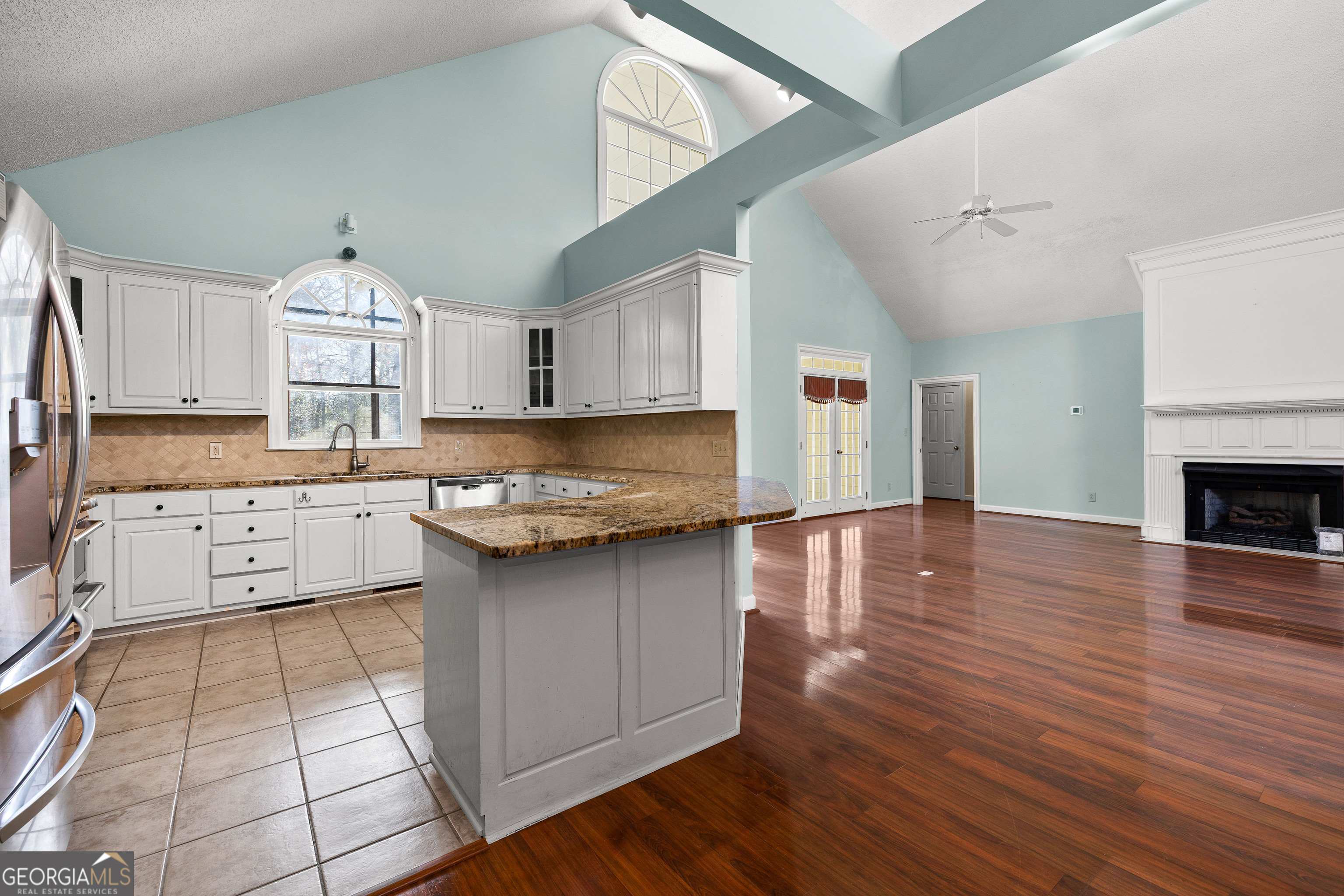 100 Beaver Run Trace Thomaston, GA 30286 - Photo 26 of 78 a kitchen with granite countertop a stove a sink and a wooden floors