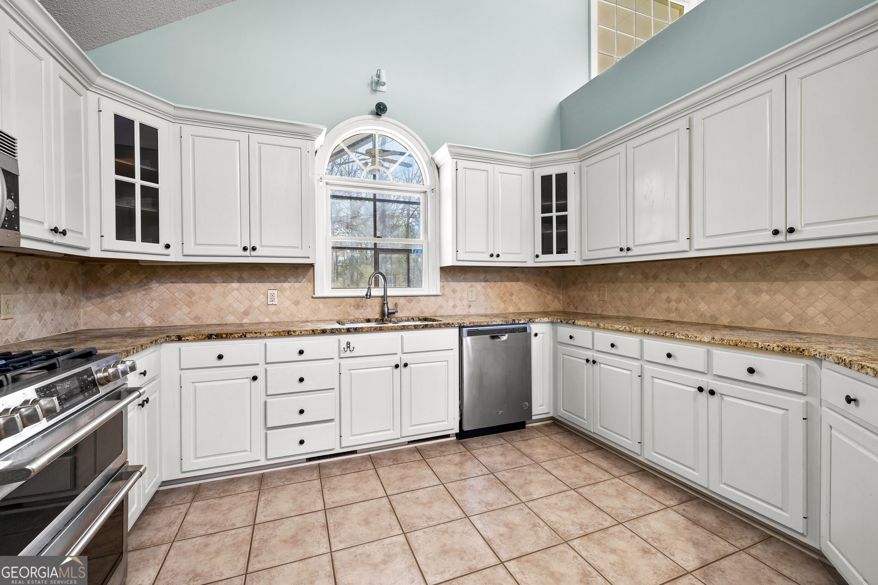 100 Beaver Run Trace Thomaston, GA 30286 - Photo 27 of 78 a kitchen with granite countertop white cabinets and white appliances