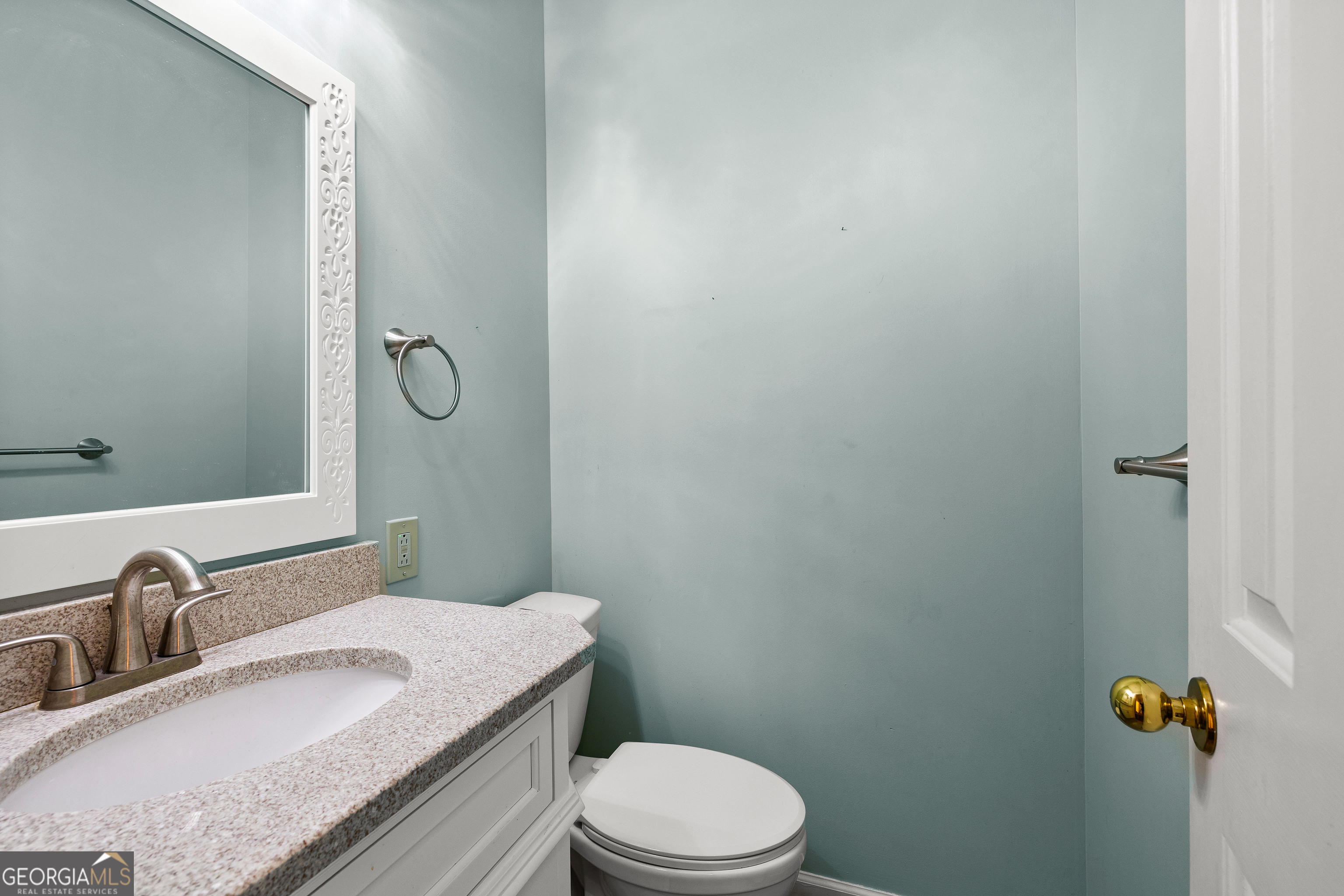 100 Beaver Run Trace Thomaston, GA 30286 - Photo 35 of 78 a bathroom with a granite countertop sink toilet a mirror and shower