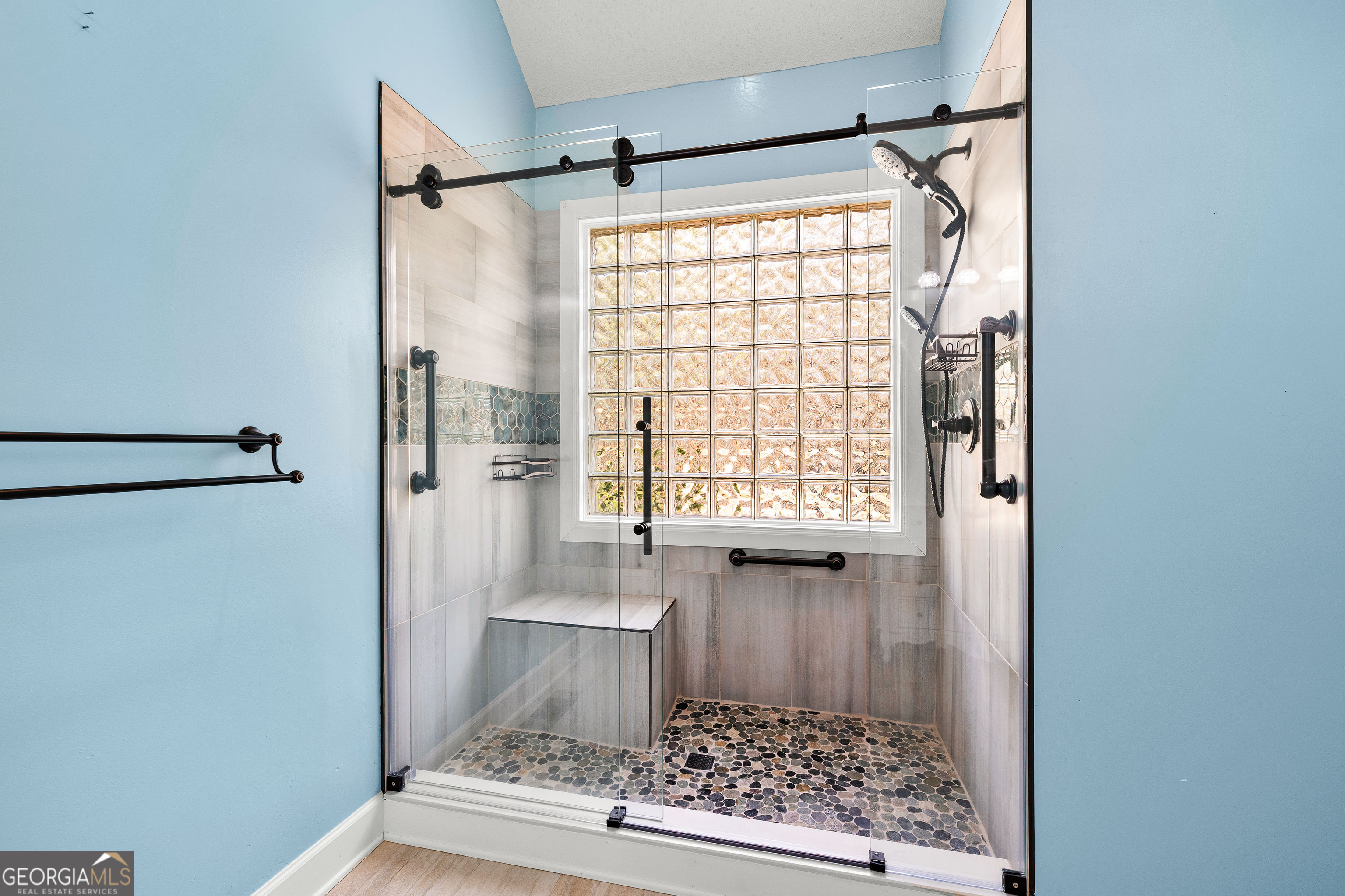 100 Beaver Run Trace Thomaston, GA 30286 - Photo 45 of 78 a bathroom with a glass shower door and a window