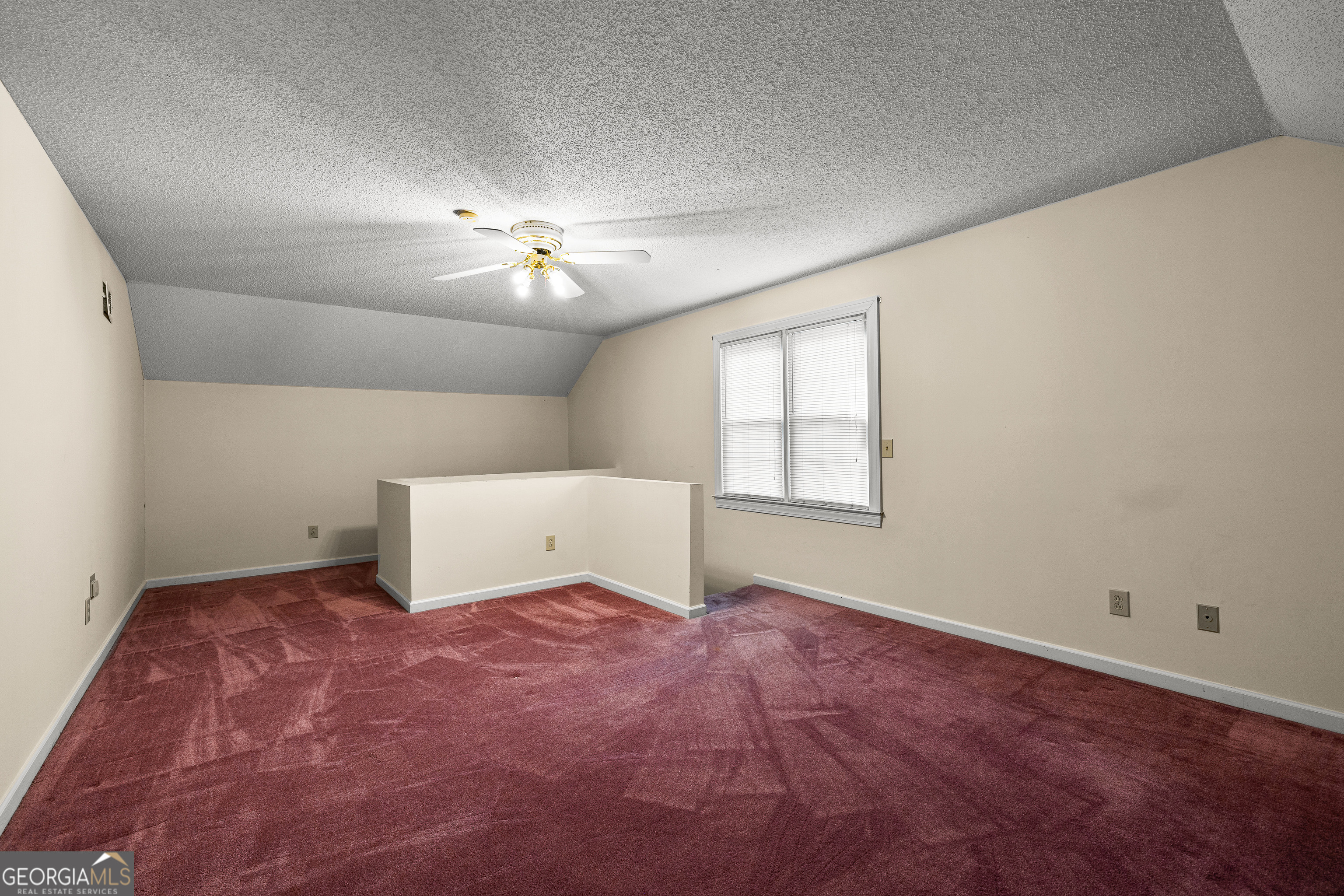 100 Beaver Run Trace Thomaston, GA 30286 - Photo 61 of 78 an empty room with chandelier fan and windows