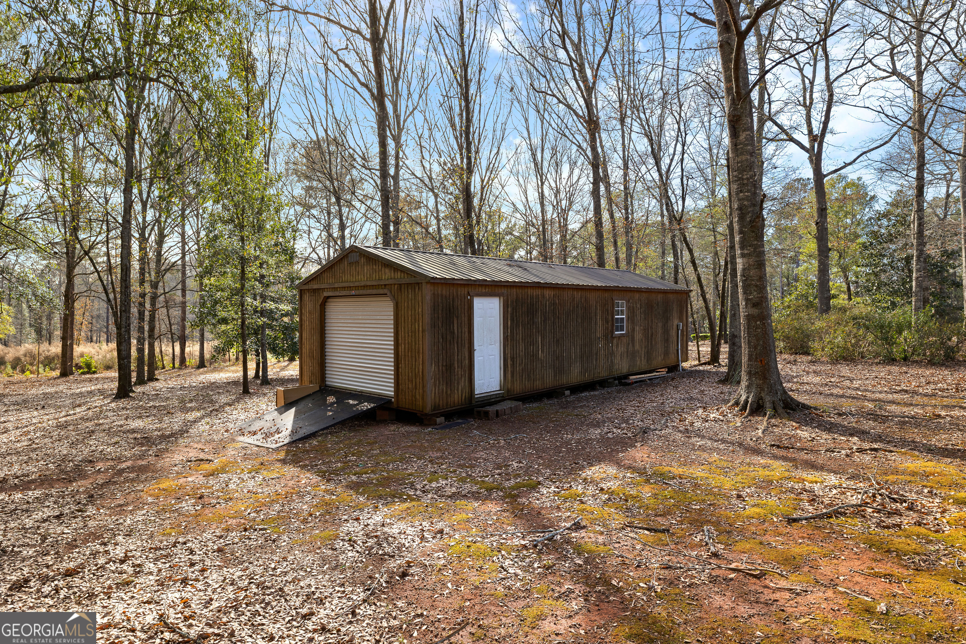 100 Beaver Run Trace Thomaston, GA 30286 - Photo 75 of 78 a view of a house with a large tree and a yard