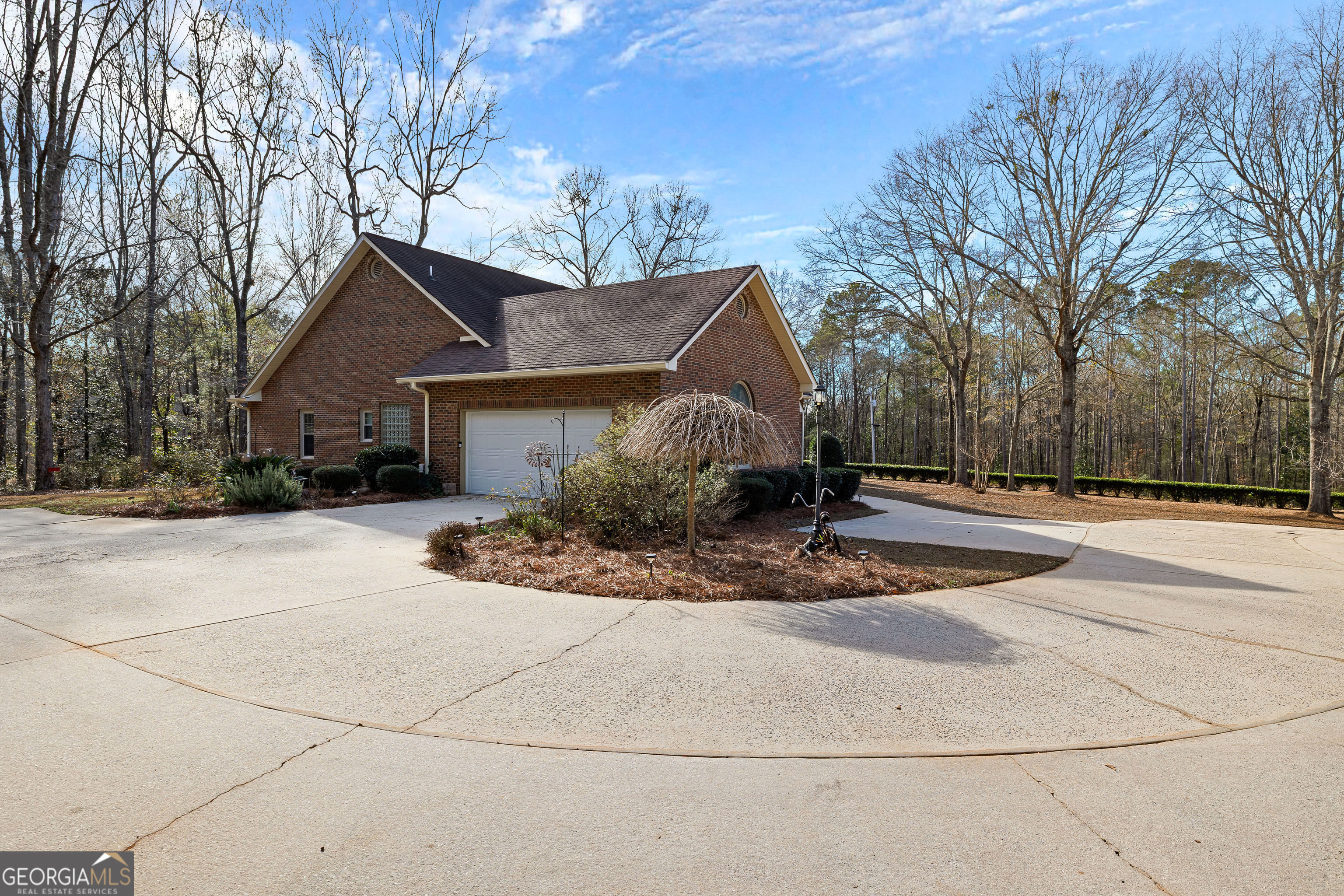 100 Beaver Run Trace Thomaston, GA 30286 - Photo 9 of 78 a view of a white house next to a road and yard