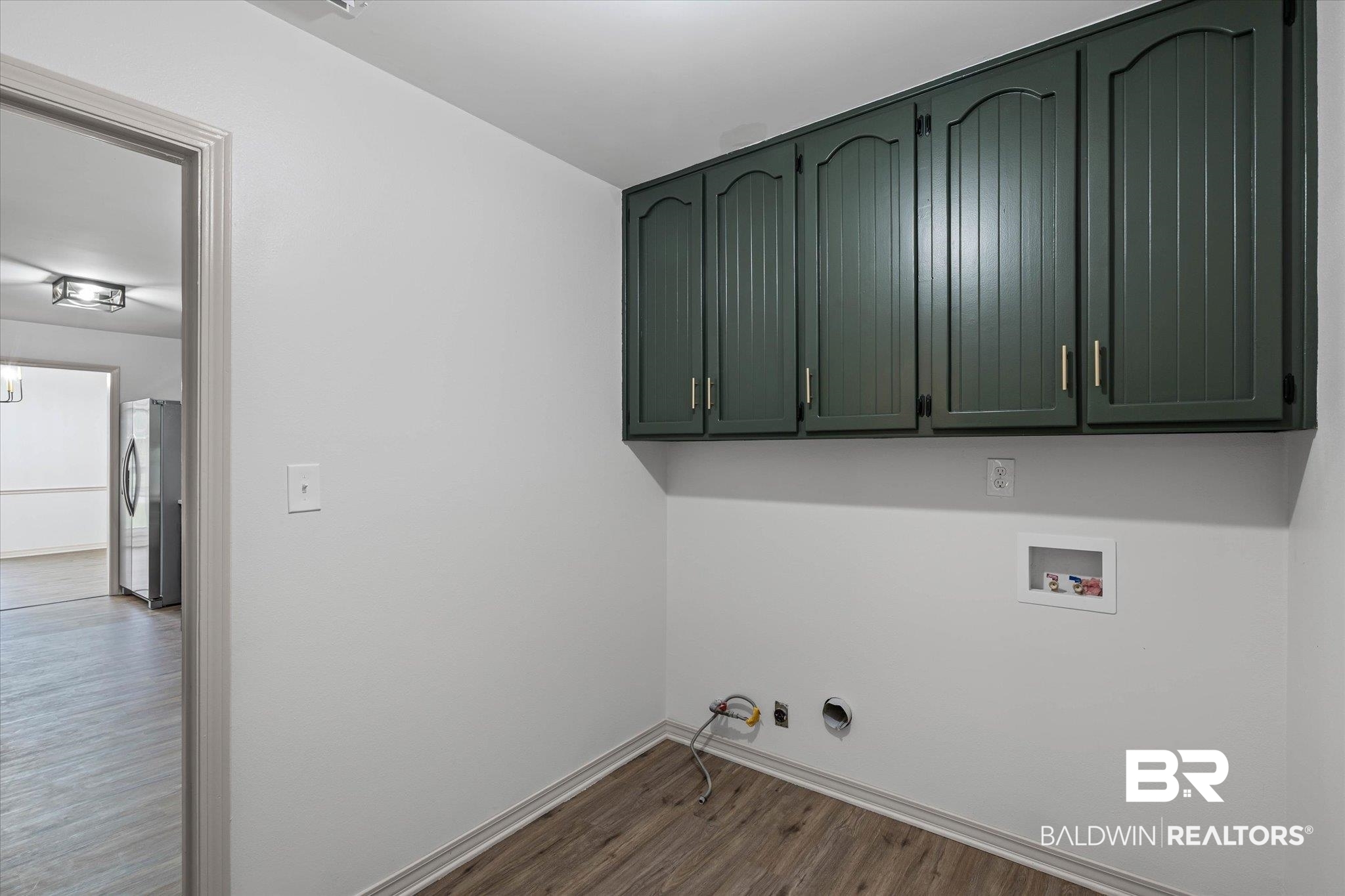 3655 Claridge Road South Mobile, AL 36608 - Photo 27 of 32 Laundry room with hookup for a gas dryer, dark wood-style flooring, hookup for a washing machine, and cabinet space