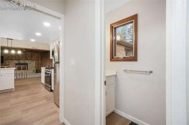 a view of a kitchen from the hallway