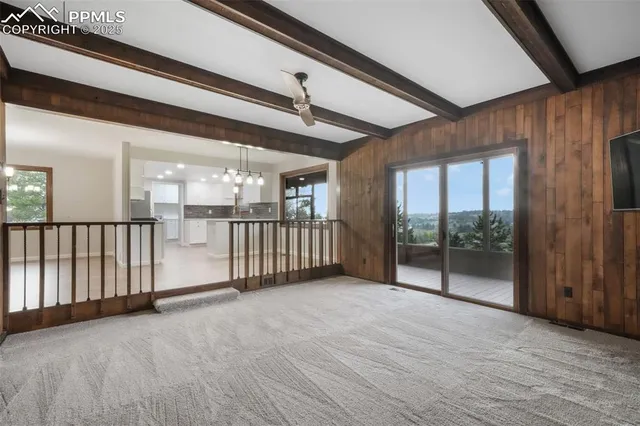 a view of an empty room with a fireplace