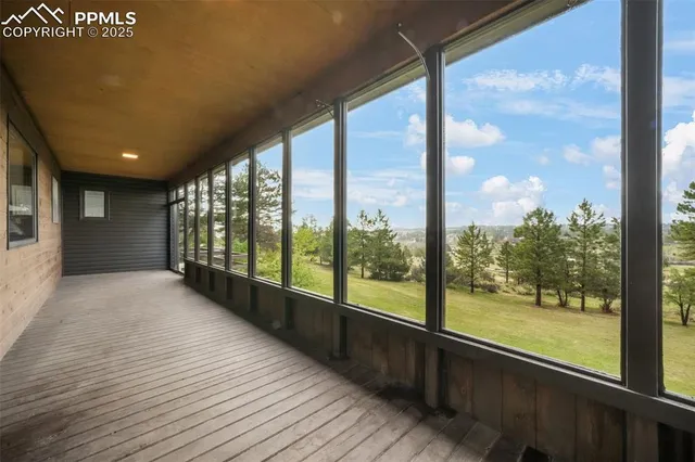 a view of an empty room with a large window