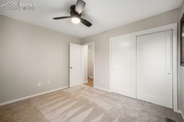 a view of an empty room and glass door
