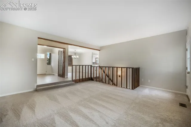 a view of an empty room with stairs