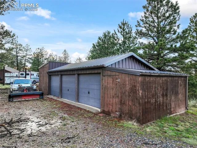 a view of a house with a yard and a pond