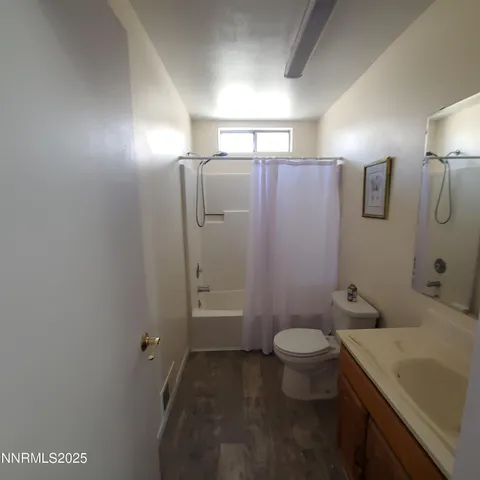 a bathroom with a sink and toilet