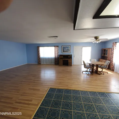 a lobby with furniture and floor to ceiling window