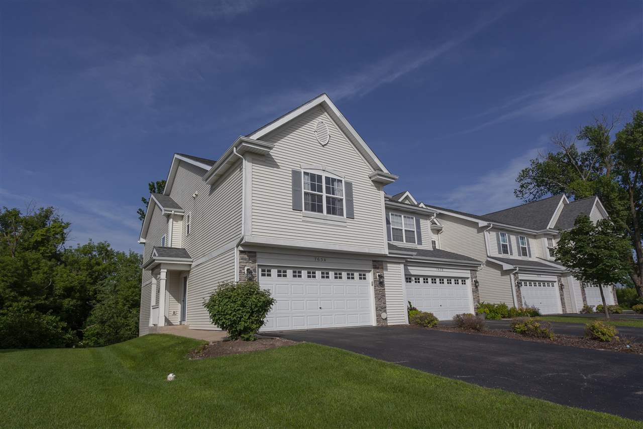 7634 Jockey Drive Loves Park, IL 61111 - Photo 1 of 25 a view of house with yard and green space