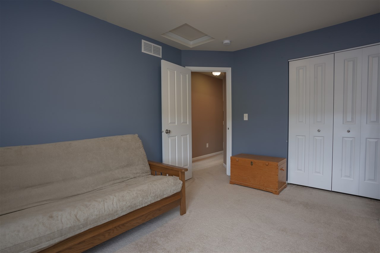 7634 Jockey Drive Loves Park, IL 61111 - Photo 13 of 25 a living room with furniture and a ceiling fan