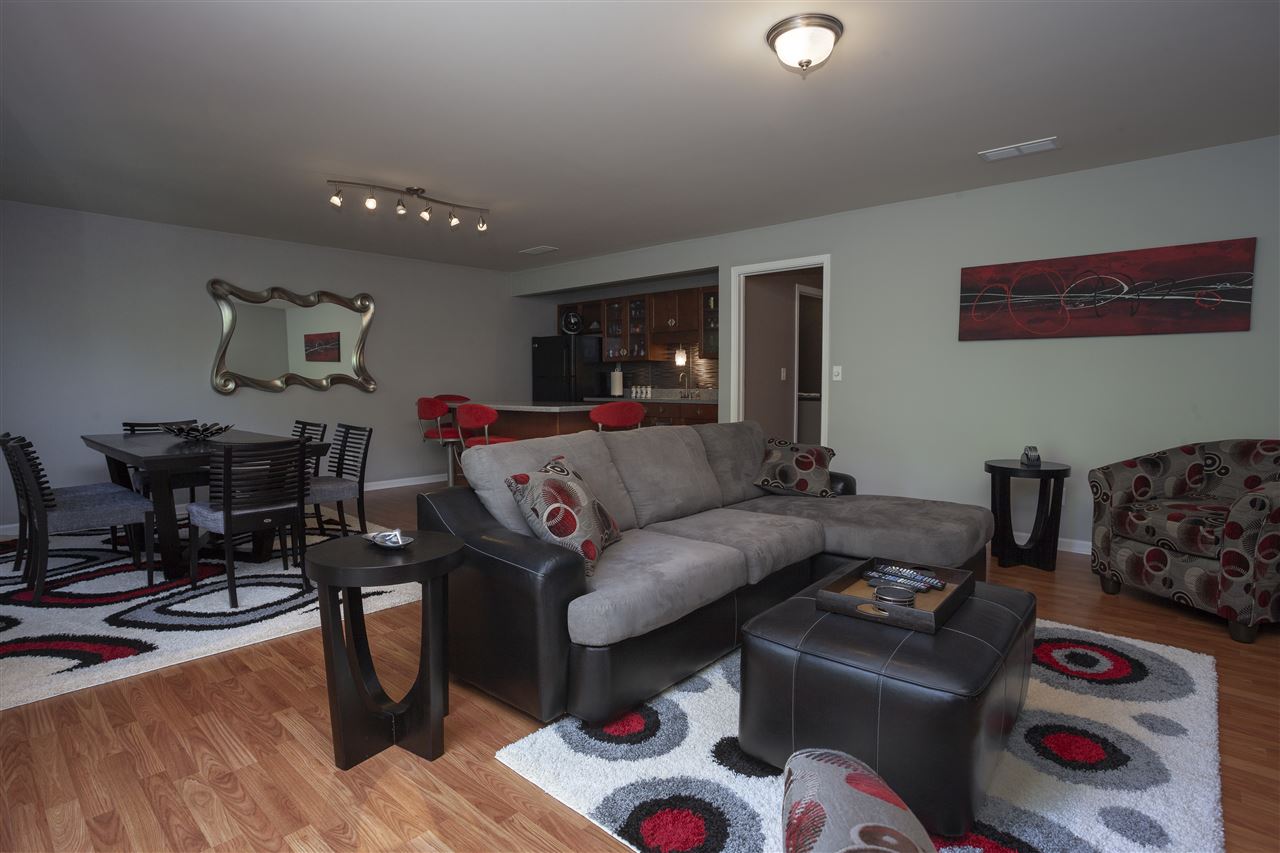 7634 Jockey Drive Loves Park, IL 61111 - Photo 16 of 25 a living room with furniture and a wooden floor