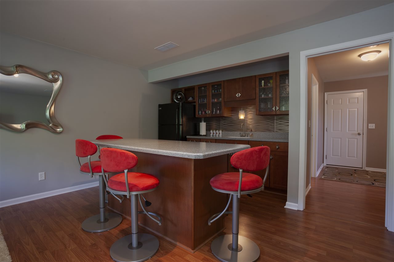 7634 Jockey Drive Loves Park, IL 61111 - Photo 20 of 25 a room with furniture and wooden floor