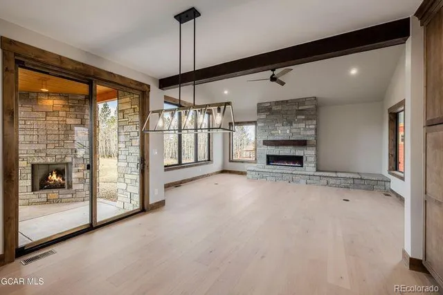 a kitchen with stainless steel appliances a sink and a refrigerator
