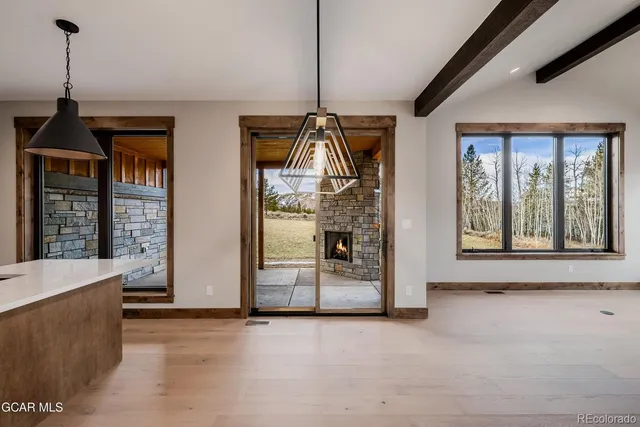 a large kitchen with kitchen island granite countertop a large counter top stainless steel appliances and cabinets