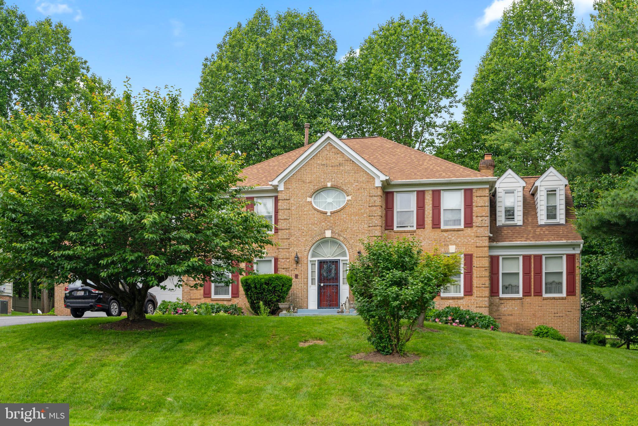 15008 Notley Road Silver Spring, MD 20905 - Photo 1 of 48 a front view of a house with a garden
