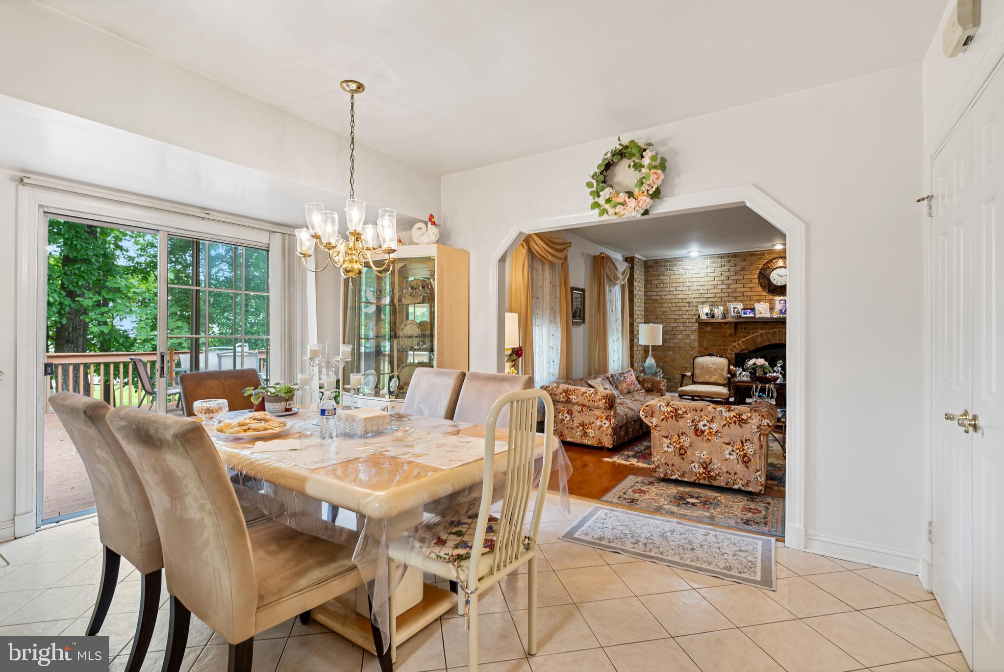 15008 Notley Road Silver Spring, MD 20905 - Photo 15 of 48 a view of a dining room with furniture wooden floor and chandelier