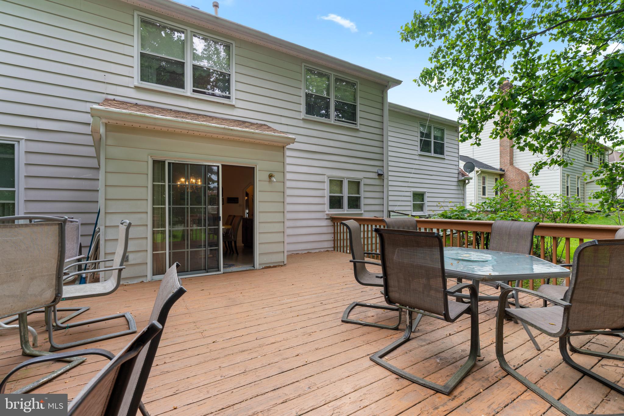 15008 Notley Road Silver Spring, MD 20905 - Photo 16 of 48 a view of a dinning table and chairs in patio of the house