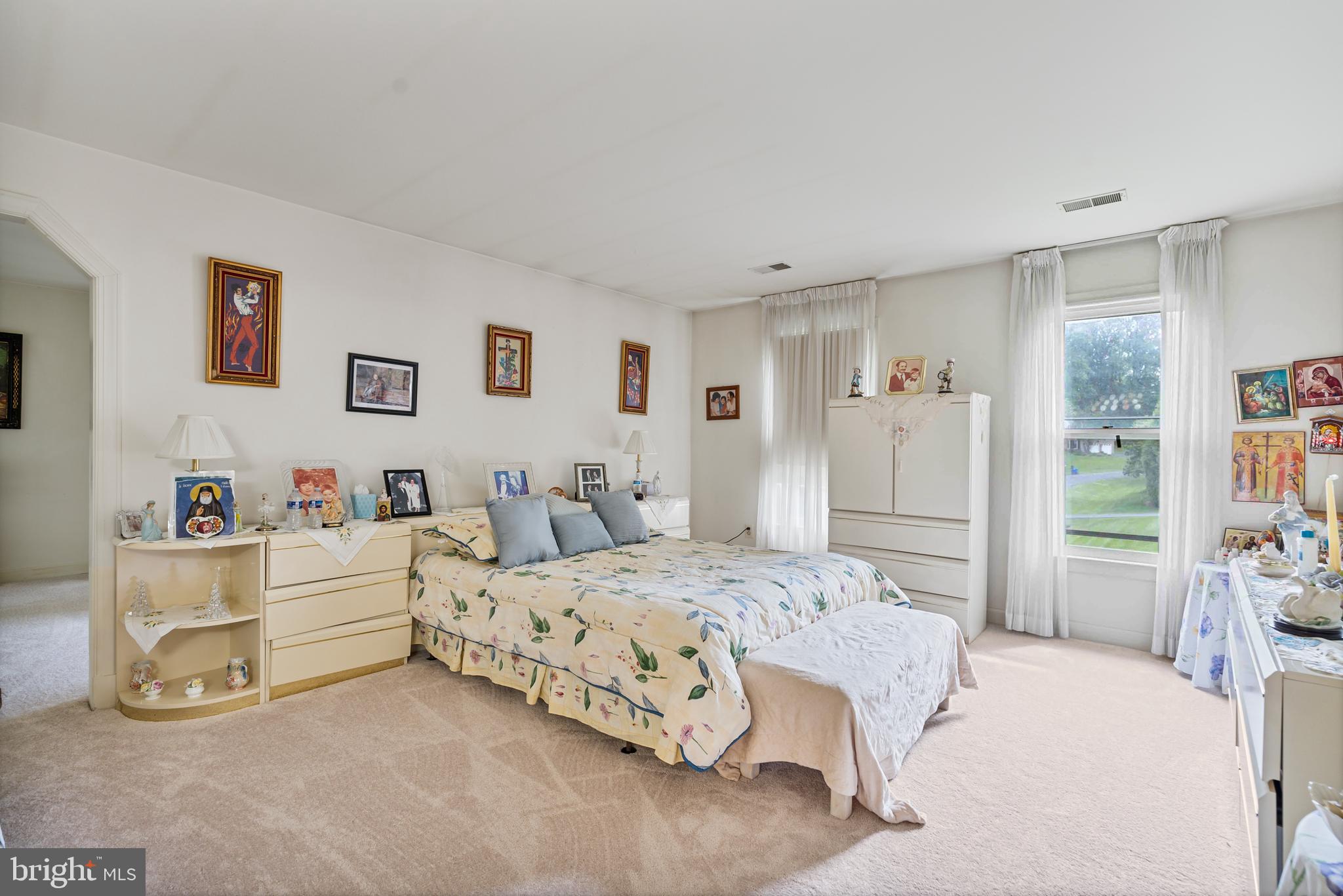 15008 Notley Road Silver Spring, MD 20905 - Photo 20 of 48 a bedroom with a bed and a cabinets