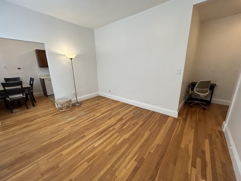 48 Strathmore Road, Unit 4 Boston, MA 02135 - Photo 7 of 10 a view of empty room with wooden floor