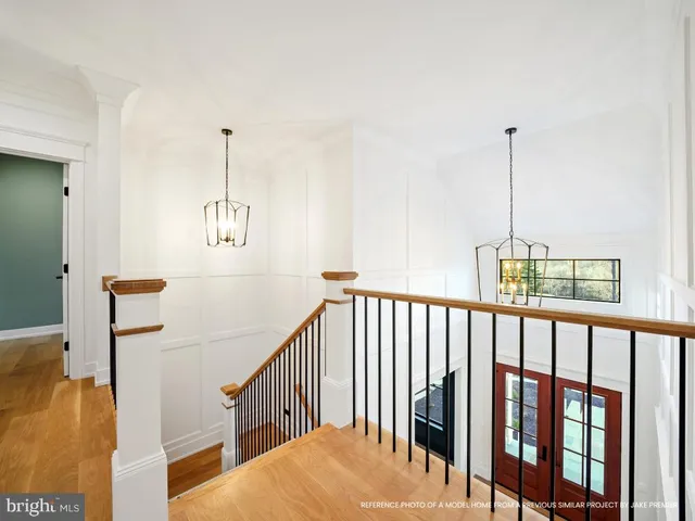 a view of a room with furniture and a flat screen tv