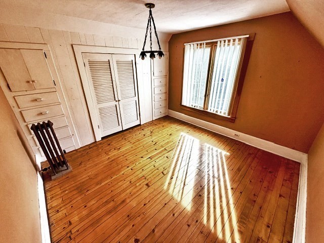 60 Massasoit Street Northampton, MA 01060 - Photo 15 of 19 a view of an empty room with wooden floor and a window