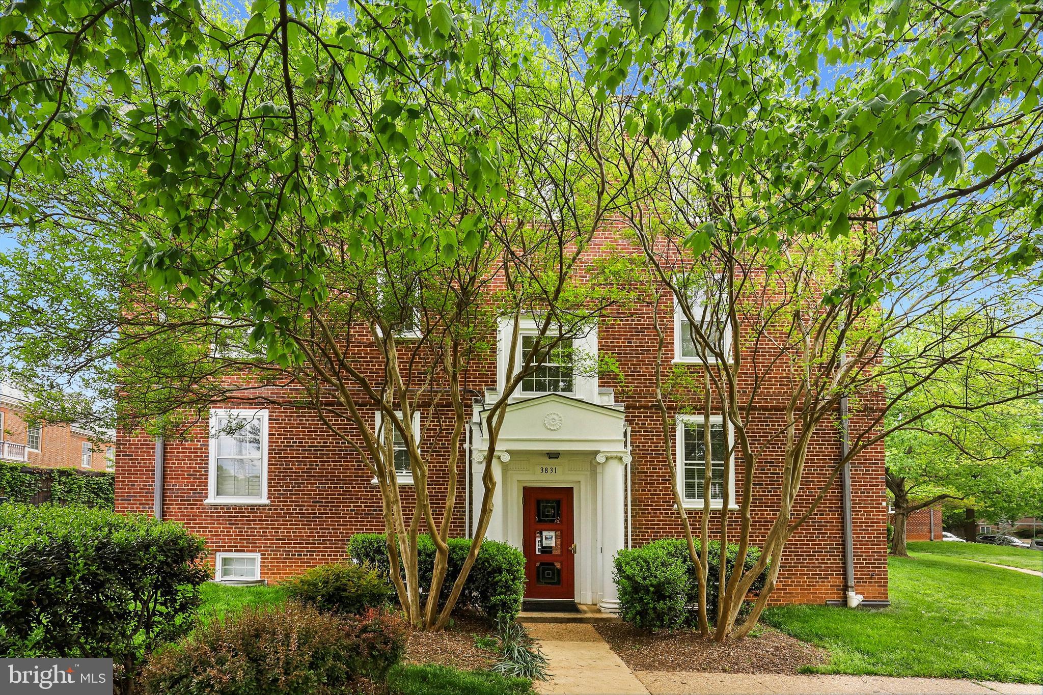 3831 Rodman Street Northwest, Unit F30 Washington, DC 20016 - Photo 1 of 33 a front view of a house with garden