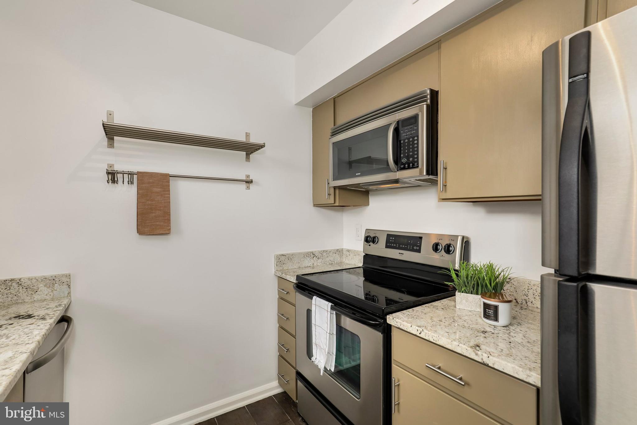 3831 Rodman Street Northwest, Unit F30 Washington, DC 20016 - Photo 13 of 33 a kitchen with a sink and refrigerator