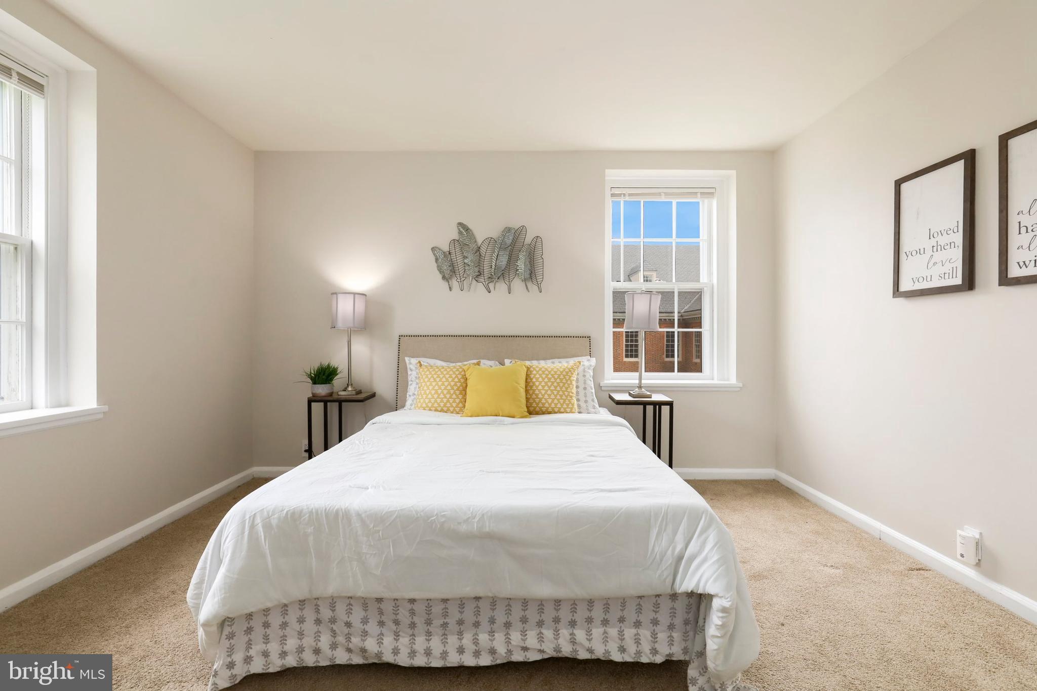 3831 Rodman Street Northwest, Unit F30 Washington, DC 20016 - Photo 17 of 33 a bedroom with a bed and window