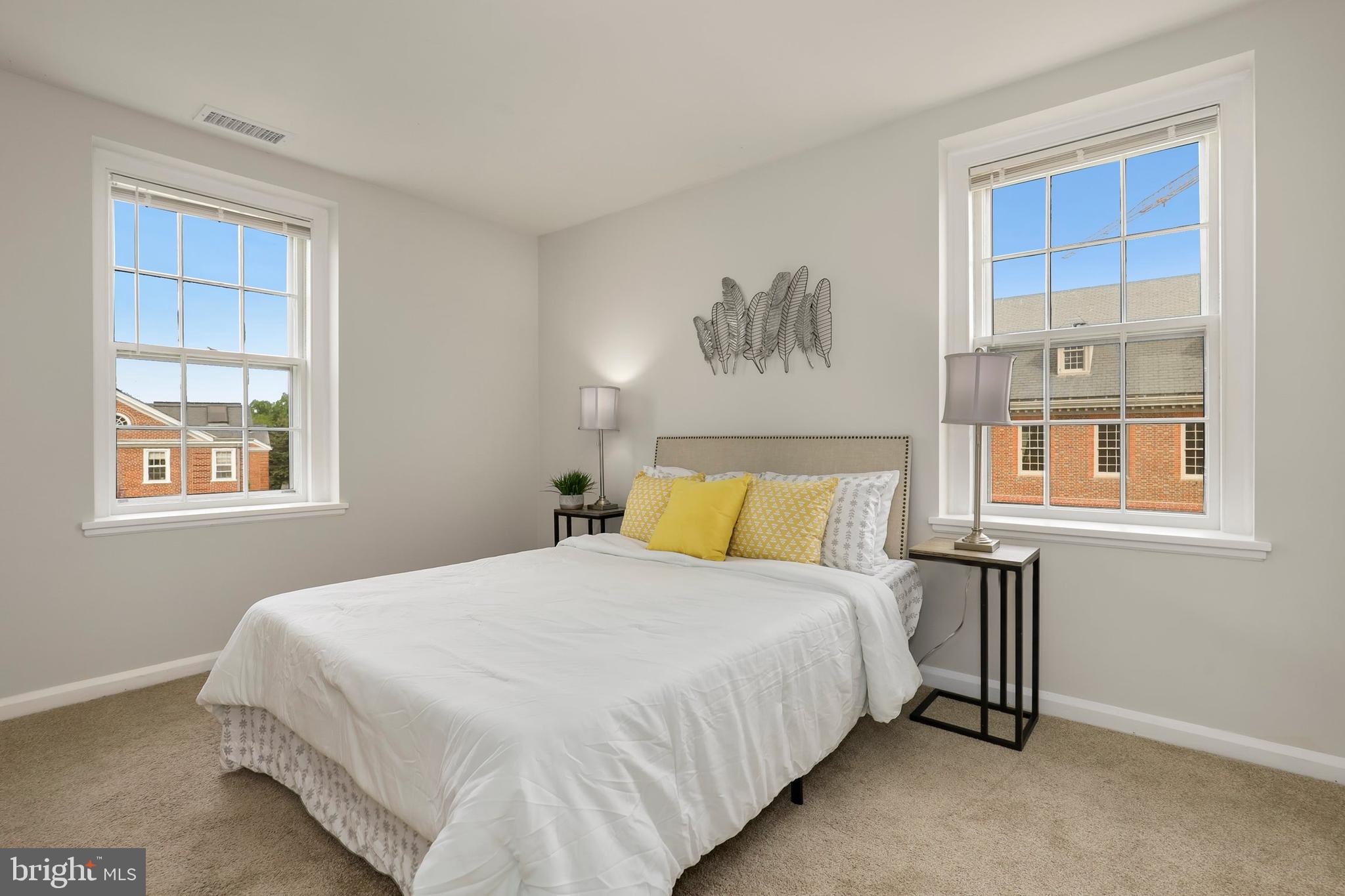 3831 Rodman Street Northwest, Unit F30 Washington, DC 20016 - Photo 18 of 33 a bedroom with a bed and a window