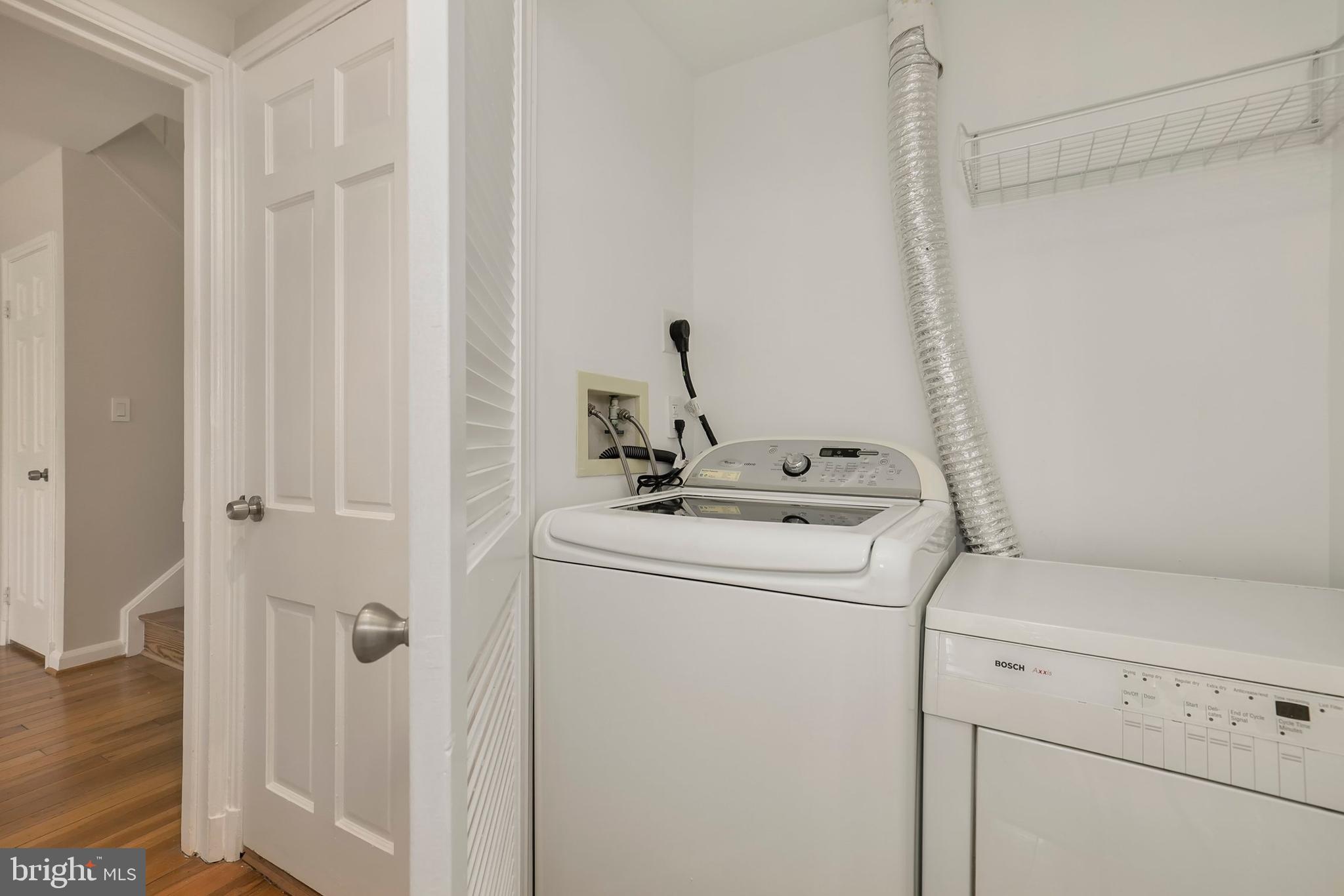 3831 Rodman Street Northwest, Unit F30 Washington, DC 20016 - Photo 22 of 33 a view of storage and utility room with washer and dryer