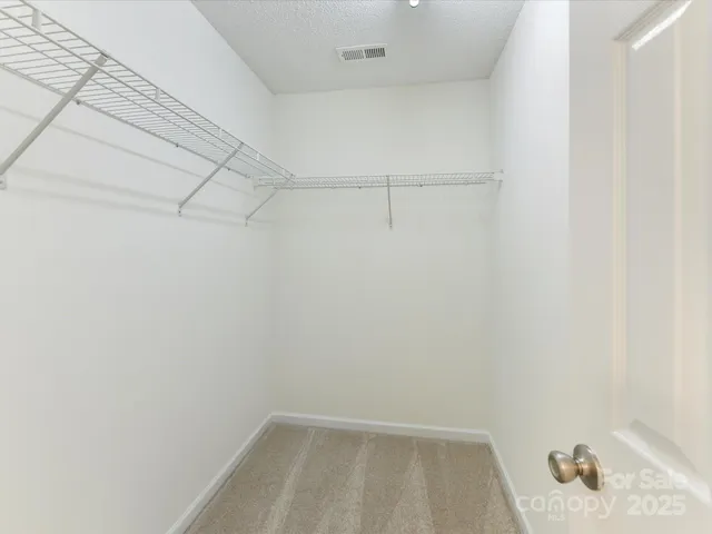 a view of a room with racks on the wall