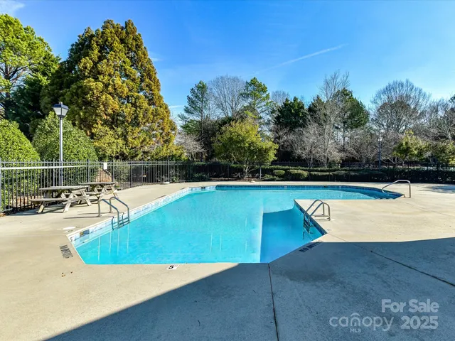 a view of a swimming pool with a lounge chair
