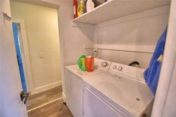 a view of a room with gym equipment and a window