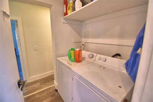 a view of a room with gym equipment and a window