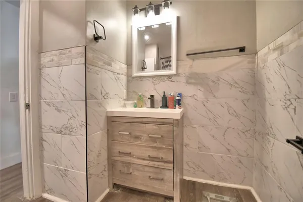 a bathroom with a shower and a shower