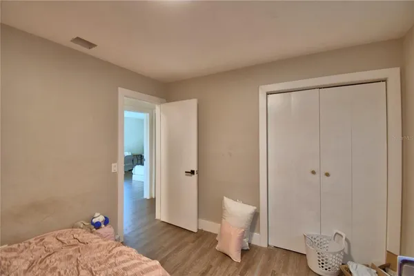 a bed room with furniture and a window