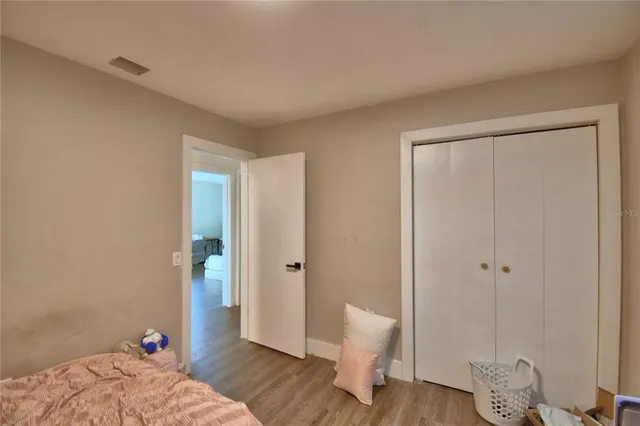 a bed room with furniture and a window