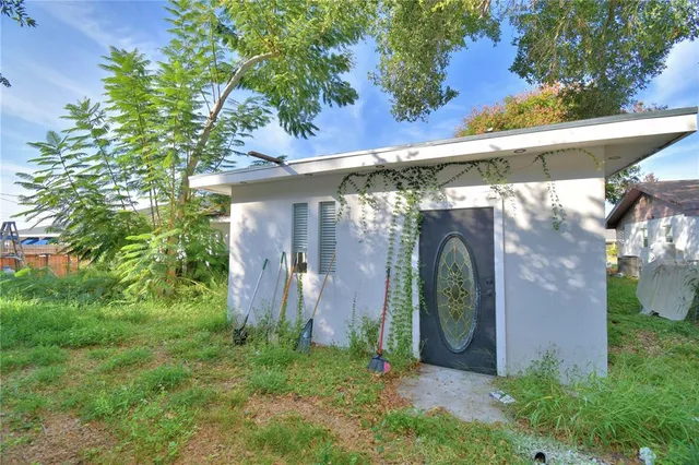 a backyard of a house with lots of green space